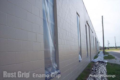 Office Building Coated with Lead Based Paint. Concrete surface encapsulated using RUST GRIP® and and top coated with ENAMO GRIP tinted to Desert Tan.